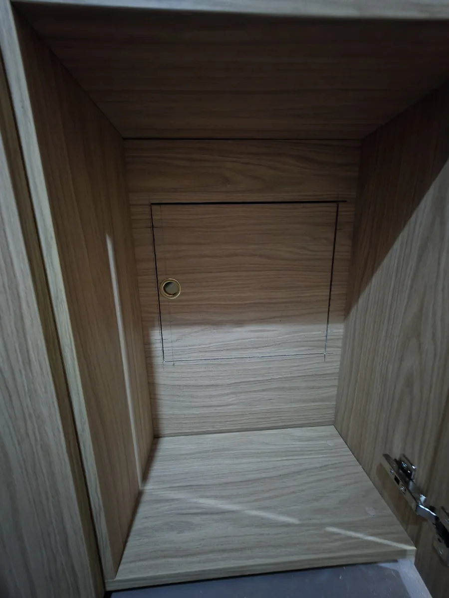 The manifold access hatch, brass ring pull